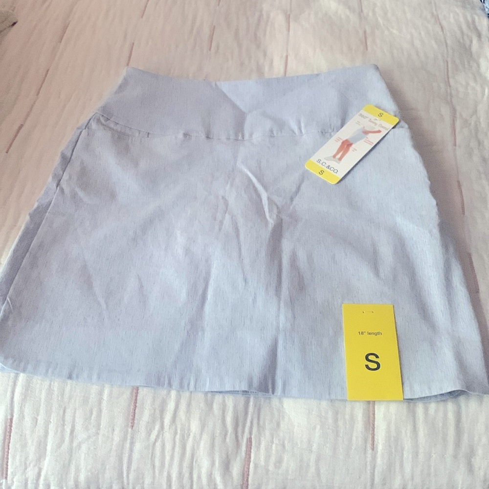 Cute light blue knee length skort from Costco brand new with tags 18 inches long